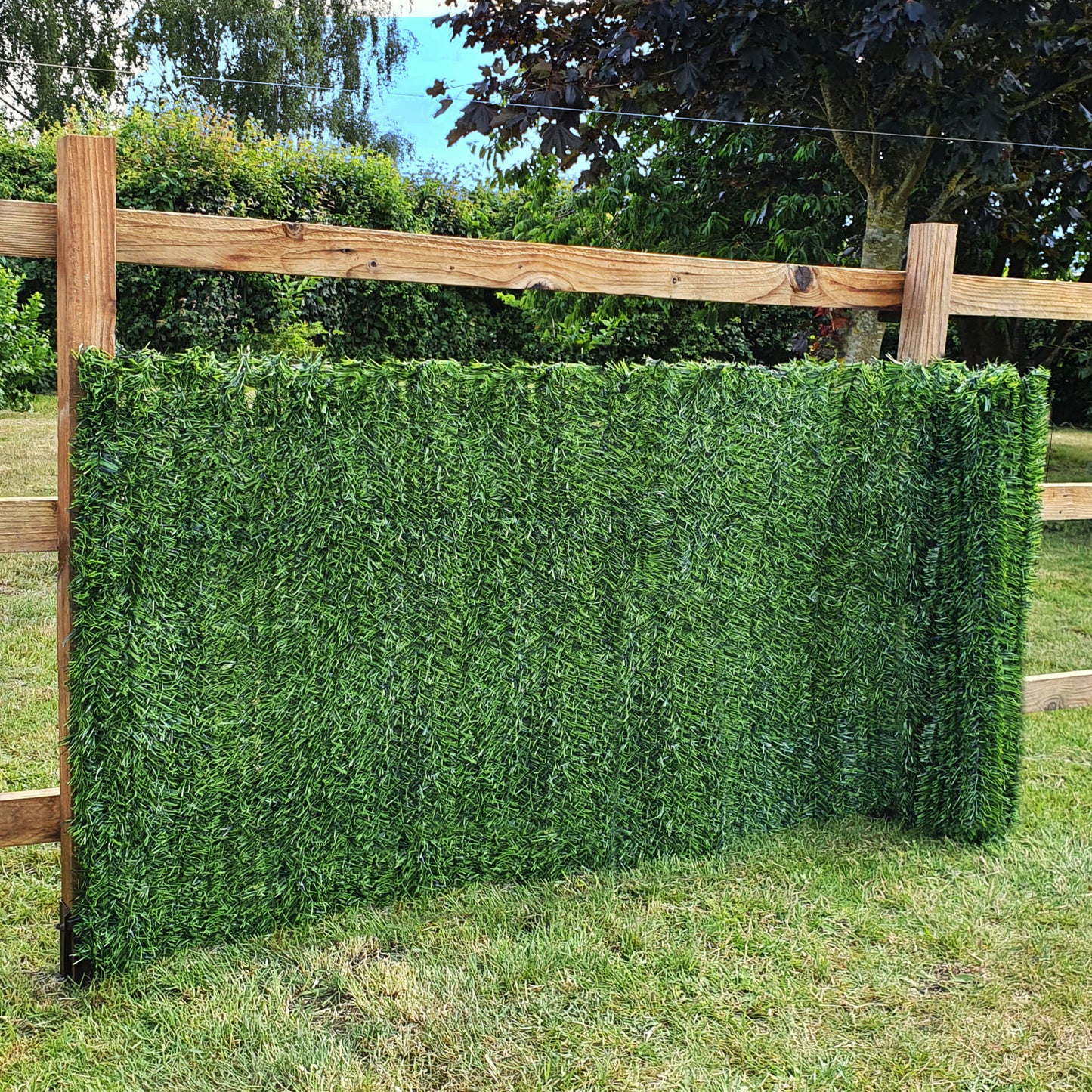Artificial Conifer Hedge Garden Fence Privacy Screening on Wood Fence